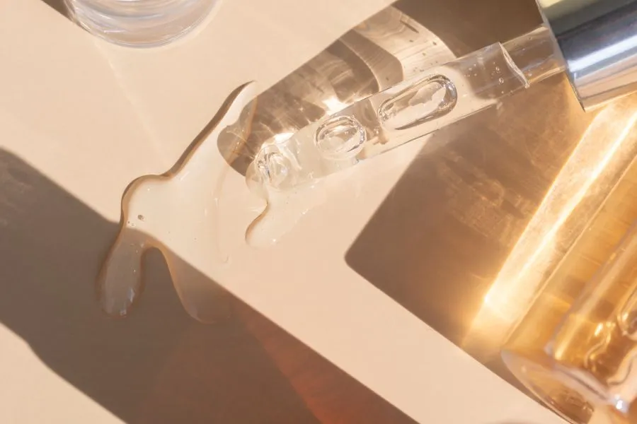 A bottle of liquid and a dropper spilling out.